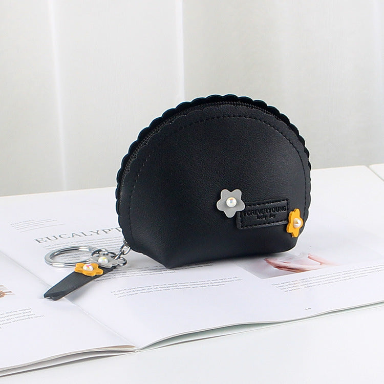 Porte-monnaie pour femme tenant une main
