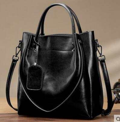 Sac portable en cuir de vachette ciré à l'huile