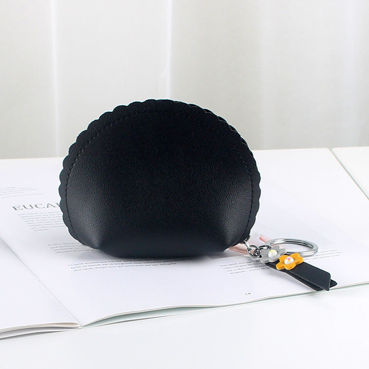Porte-monnaie pour femme tenant une main
